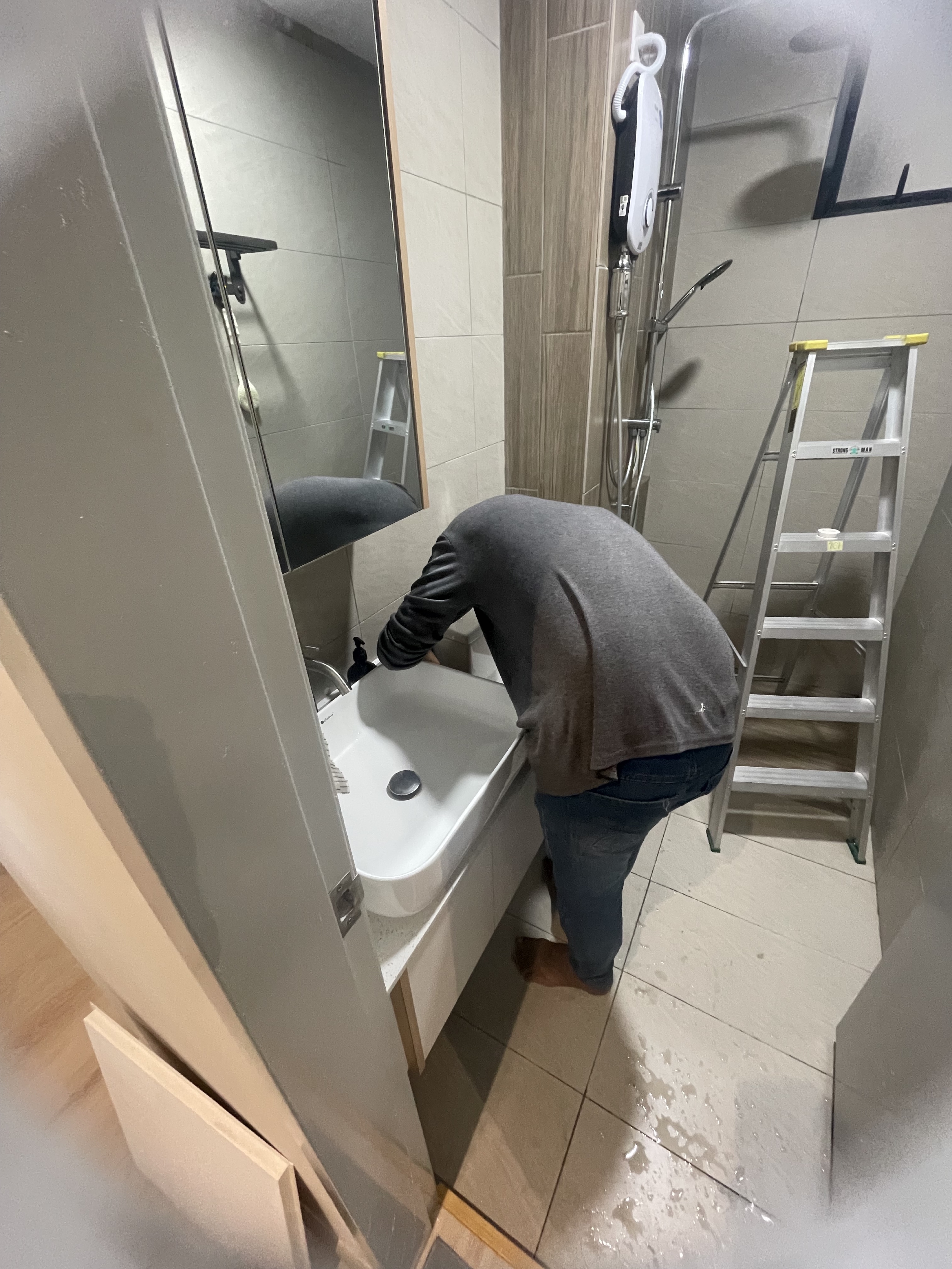 Basin repair in condo bathroom