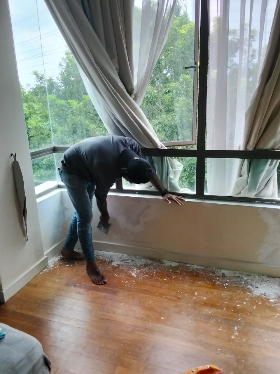 Wall damp repair near window